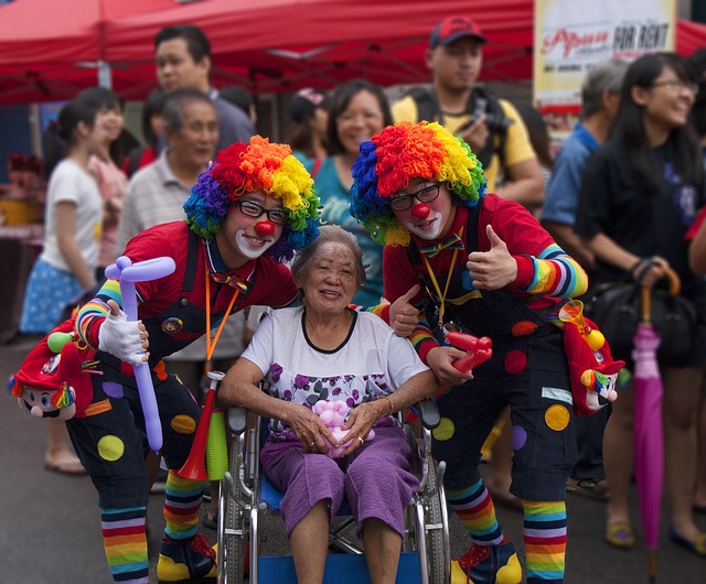 Clowns with elderly lady