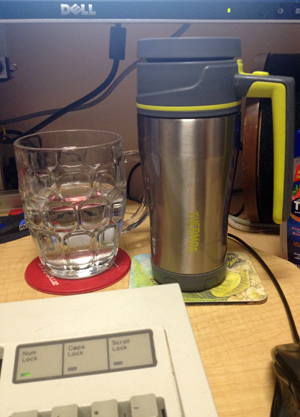 Coffee mug on computer desk